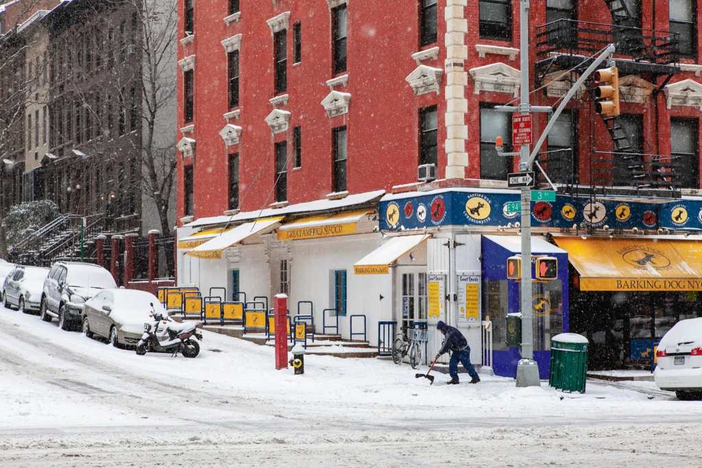 Upper East Side, Manhattan covered in snow, New York City by Guney Cuceloglu