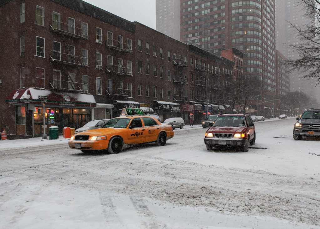 Upper East Side, Manhattan covered in snow, New York City by Guney Cuceloglu