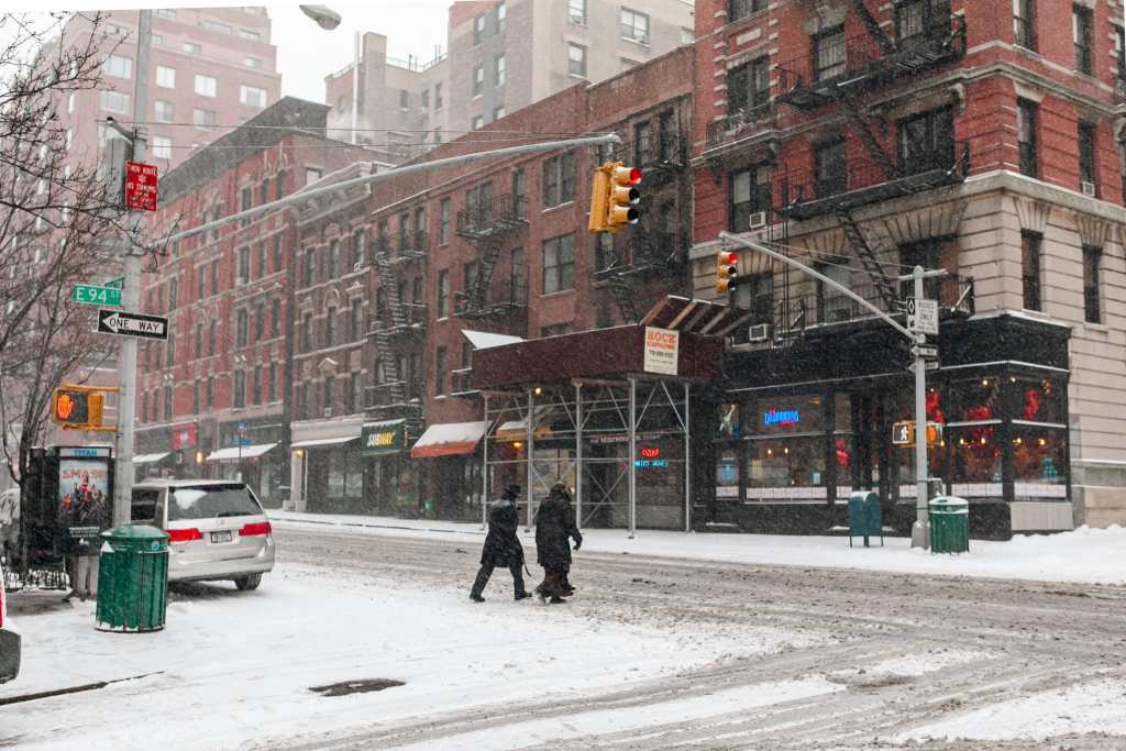 Upper East Side, Manhattan covered in snow, New York City by Guney Cuceloglu